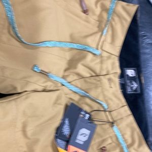 Brand New!! Orage Chica Ski Pant in Large. Golden in color with turquoise belt